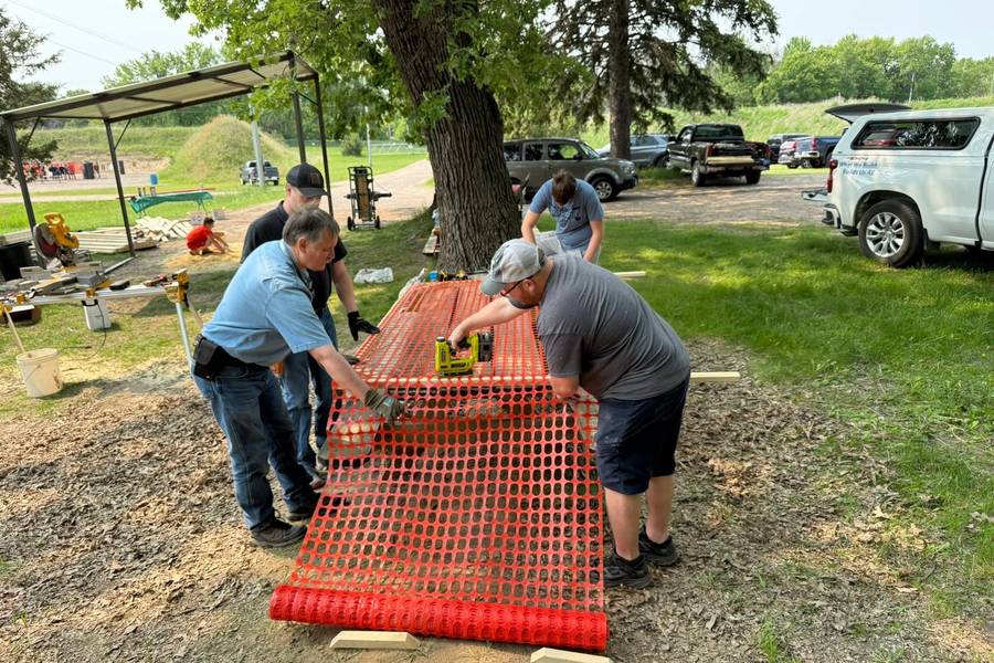 Club members working together during a volunteer work day at Forest Lake Sportsmen's Club